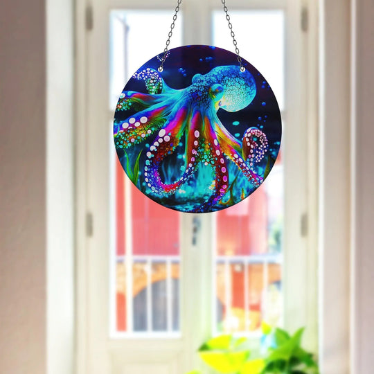 The intricate details of the colorful octopus artwork dominate this charming blue octopus suncatcher, offering a striking piece of home decoration.