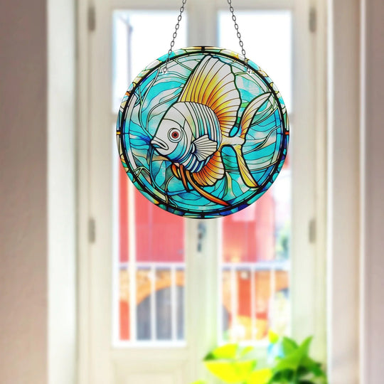 Warm hues radiate from the center of the blue big fish suncatcher, a striking tempered glass wall art piece exhibiting both cool and warm color temperatures.
