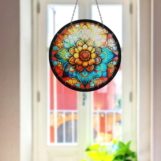 Vibrant color contrast highlights the orange and teal hues of this stained flower suncatcher, a beautiful piece of glass art painting that brightens any window.