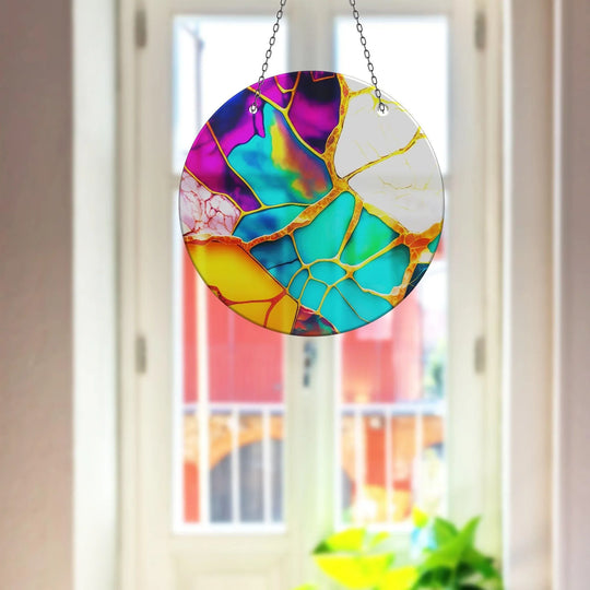 Featuring a distinct layering effect, the marble purple and blue suncatcher showcases vibrant wall prints that refract light, creating a colorful display.