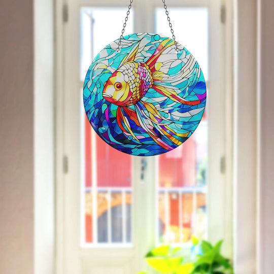 Layered design featuring a goldfish suncatcher creates depth with vibrant colors and mosaic-like segments enhancing the visual interest of this glass wall artwork.