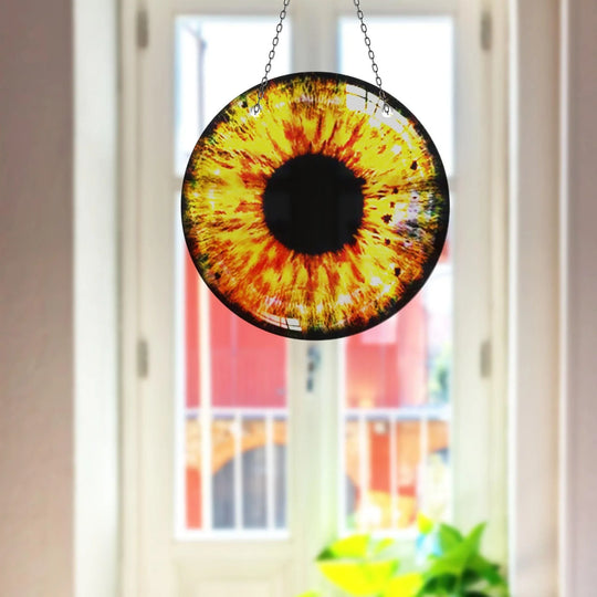 Light and shadow play across this yellow eye suncatcher, creating captivating contrast in this mesmerizing print wall art.