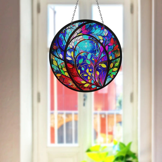Radiating vibrancy, this colorful suncatcher decor evokes a dynamic sense of movement through its swirling design, a stunning piece of art from glass.