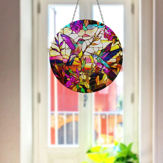 Featuring a bordered edge, the suncatcher showcasing hummingbird art with colorful acrylic presents lovely decorative wall prints.