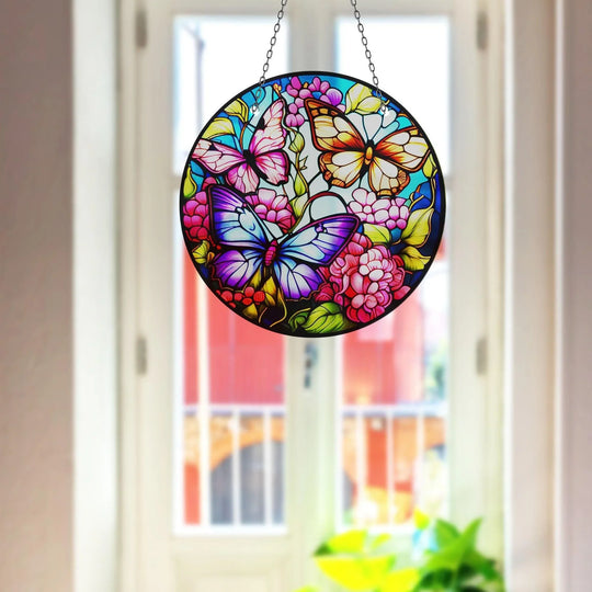 Showing the realistic detail, a circular Butterflies Suncatcher Decor piece is displayed, exemplifying the best glass art with vibrant colors and delicate butterfly and flower designs.