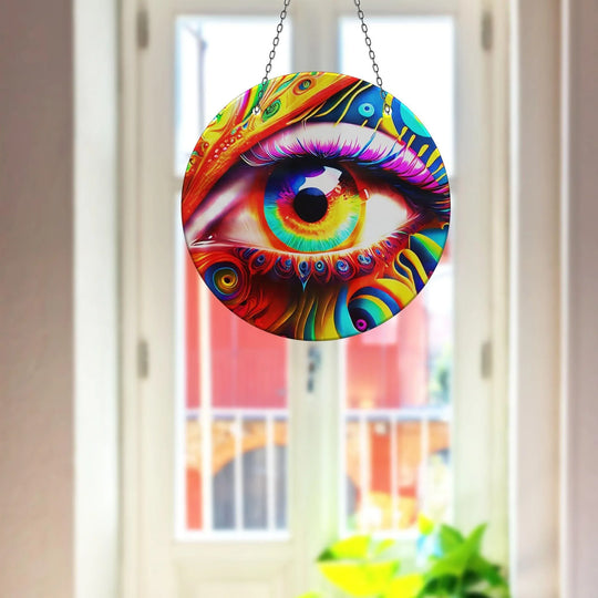The realistic detail in this colorful eye suncatcher decor shows a vibrant glass art painting with intricate patterns and rainbow hues in the eye's iris.