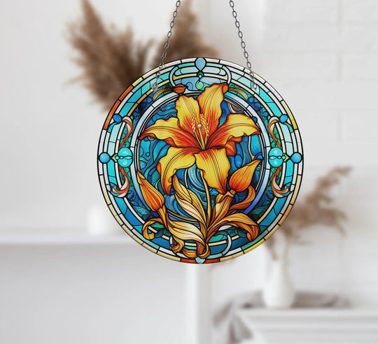 The central subject is an orange and blue stained flower design that showcases the detailed glass art painting of this vibrant suncatcher.