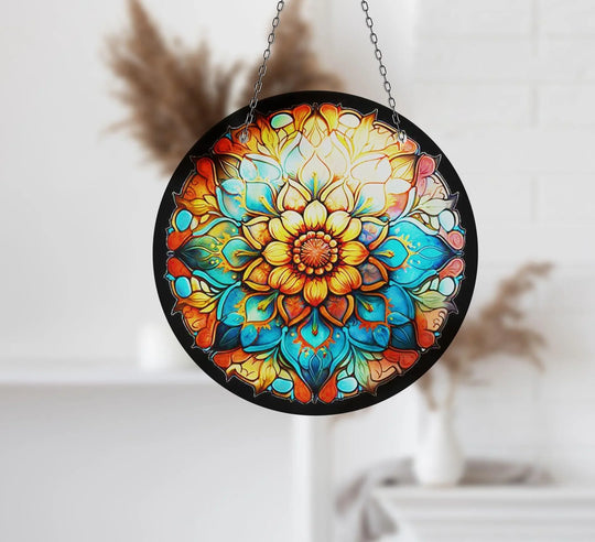 Radiating from the vibrant orange stained flower suncatcher's center, the bright glass printing highlights the intricate design and color of this hanging glass art.