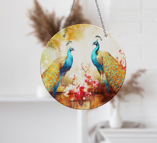 Highlighting the layering effect, the blue peacock suncatcher showcases best glass art with its multi-dimensional design featuring vibrant birds and floral elements.