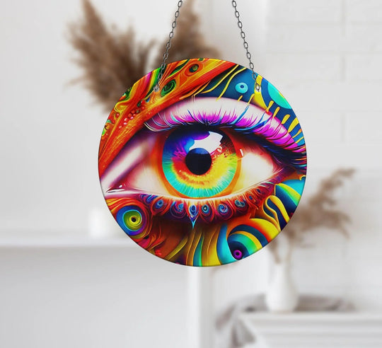 The tempered glass edge of this colorful eye suncatcher decor artfully frames the vibrant design, enhancing its appeal as unique modern wall decor.