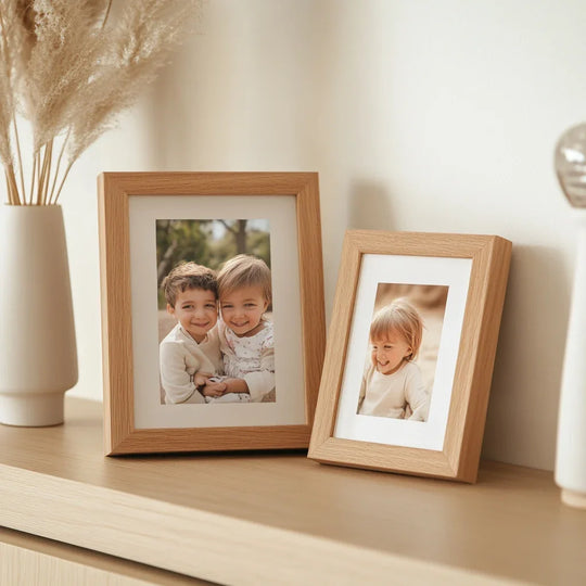 Light-toned natural wood frames provide subtle color contrast to the bright photos in this glass photo printing display.