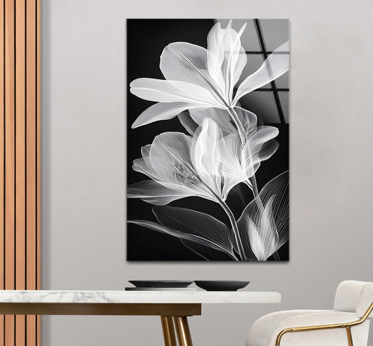 Bold black and white line art flower glass art dominates the image, bringing a touch of modern elegance and serving as the loudest element.