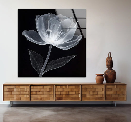Shifting from opaque black to crystalline white, this floral glass wall art highlights the beautiful transition between colors achieved through precise glass printing.