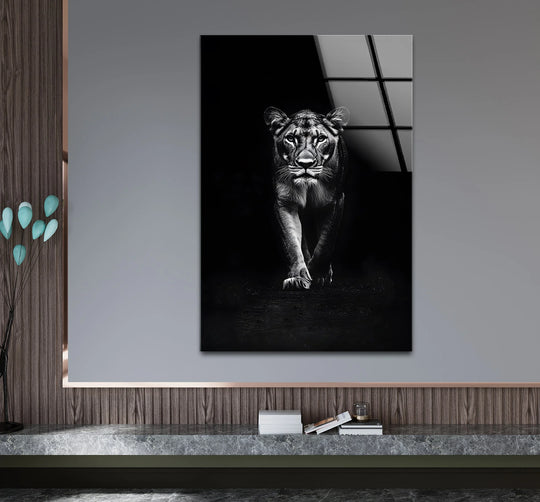 A fierce lion portrait on glass wall art with a striking, reflective finish.