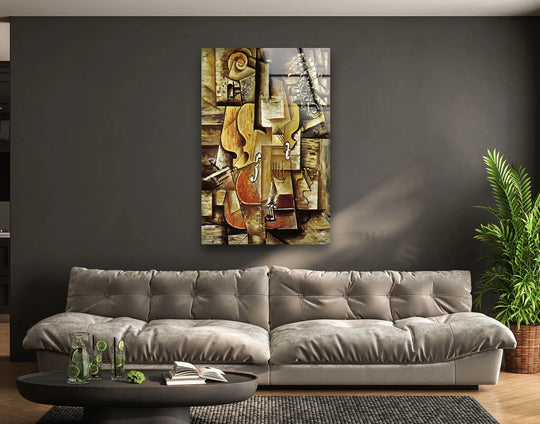 The plush gray sofa features soft, tufted cushions creating a sense of comfort below the vibrant glass wall artwork.