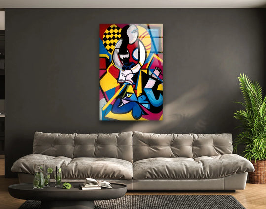 A bold abstract glass wall print, featuring the iconic Picasso's Abstract Painting, creates dynamic negative space with its vibrant geometric shapes and figures.
