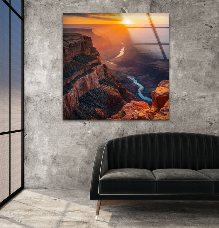 Glass wall art featuring the Grand Canyon’s rugged cliffs in warm evening light.
