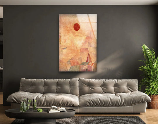 Glass print wall art featuring a vibrant red sun and abstract geometric structures with a lustrous finish.