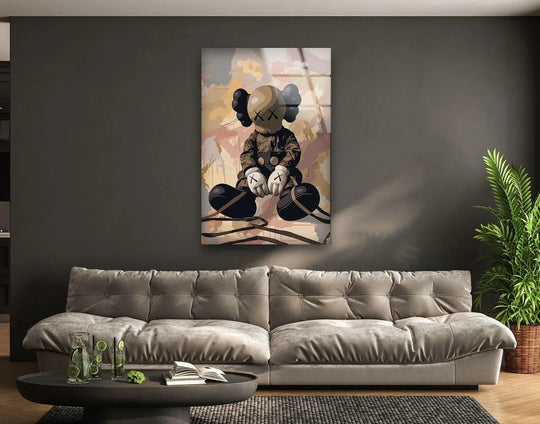 Kaws picture features seated figure and is cool art with neutral colors and durable tempered glass and modern design and it is contemporary wall decor