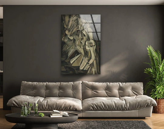 Luxurious tufted grey couch with plush cushions as the softest element near the Marcel Duchamp glass wall artwork.