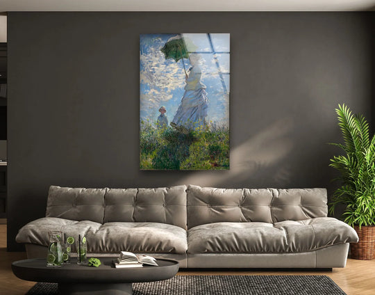 Monet's 'Woman with a Parasol' masterpiece in art from glass captures a serene moment with vibrant sky and lush meadow.