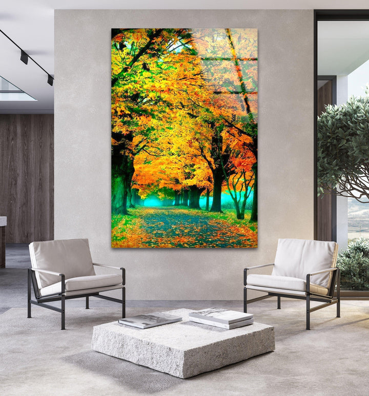Vivid fall foliage and a serene forest path, printed on high-quality glass wall art.

