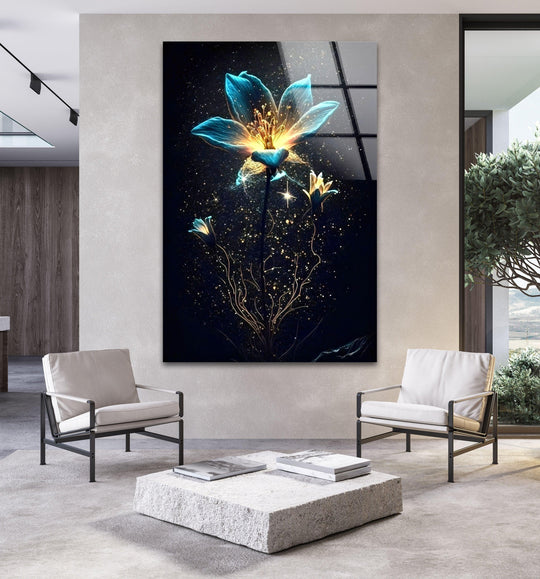 In the foreground, a stone block coffee table and two modern chairs sit before the Bioluminescent Flowers glass printing, a dark floral art piece, in a living room setting.