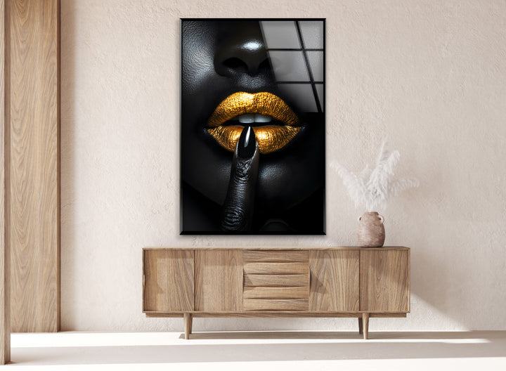 Luxurious black lips with gold highlights, creating a powerful visual impact on glass.
