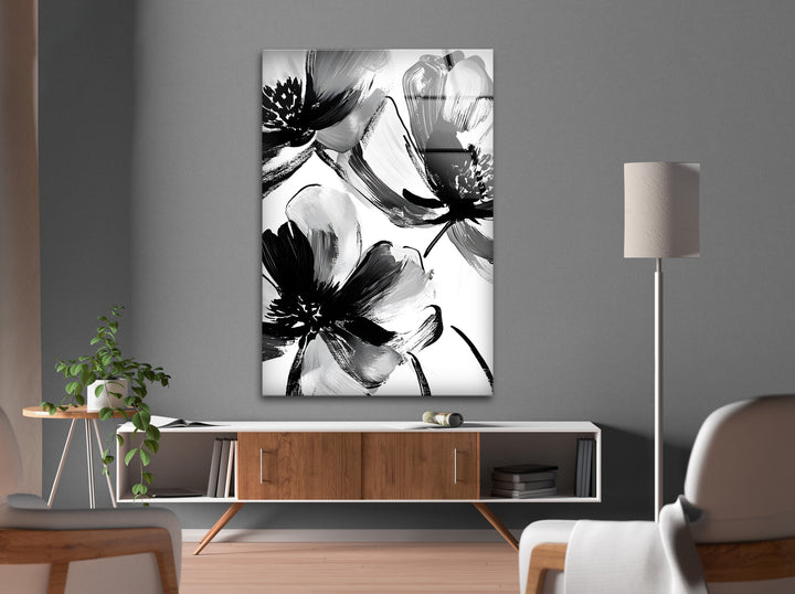 Contemporary floral design in a bold black and white palette, beautifully printed on glass wall art.
