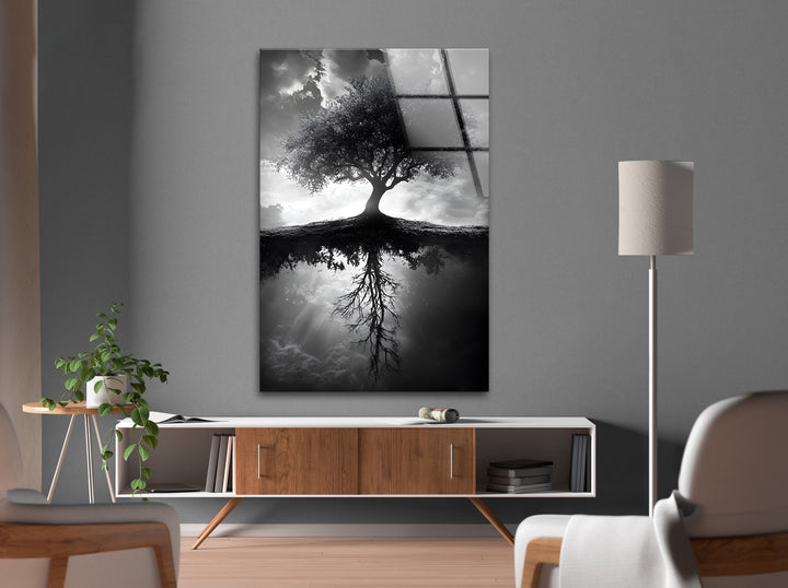 High-definition black and white glass wall art depicting a lone tree and its deep reflection.
