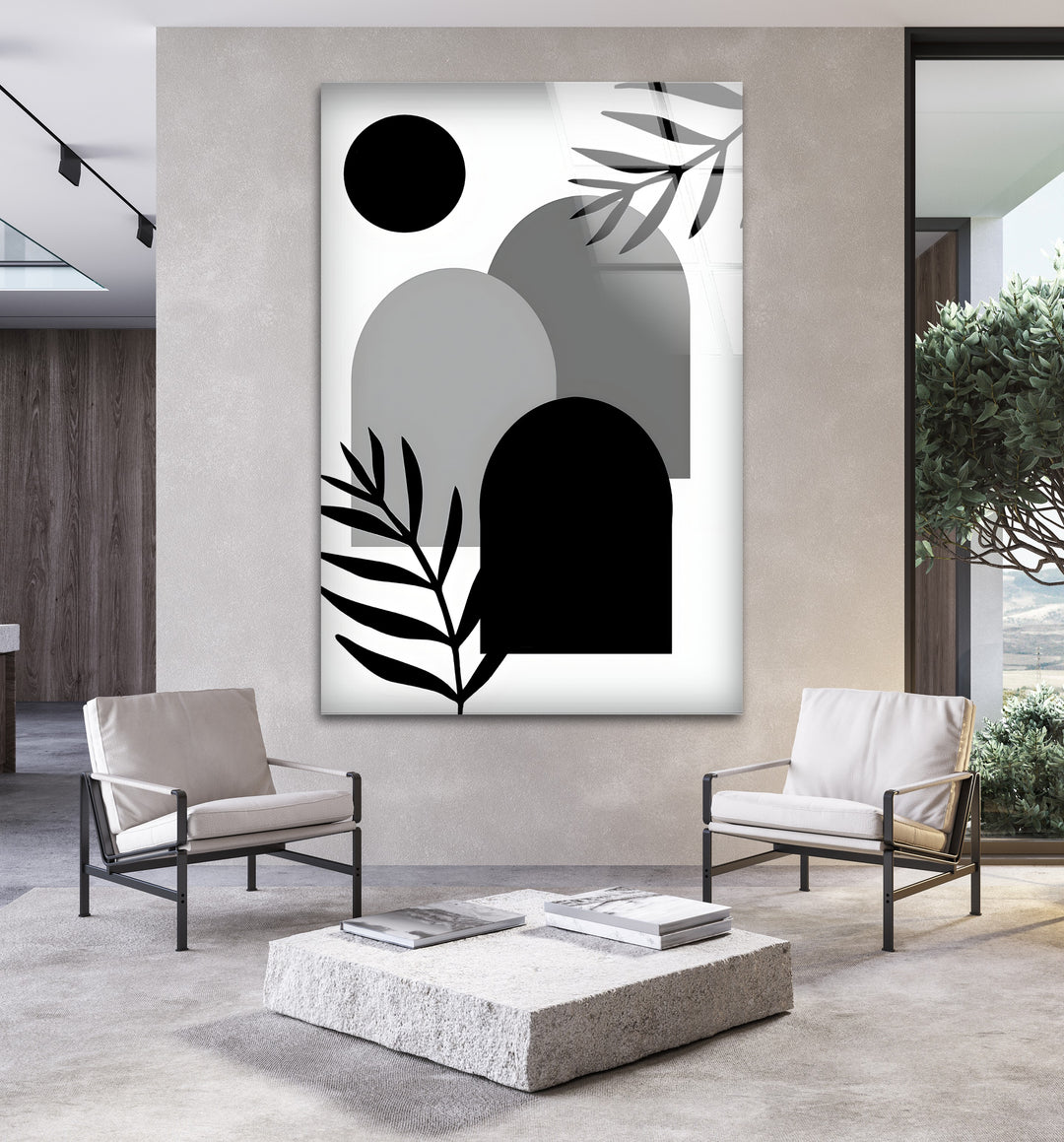 A striking black and white wall decor piece featuring elegant curves and structured forms.

