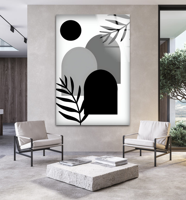 A striking black and white wall decor piece featuring elegant curves and structured forms.

