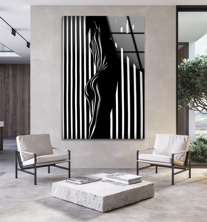 Minimalist yet bold, this black and white glass wall art showcases a unique silhouette composition.
