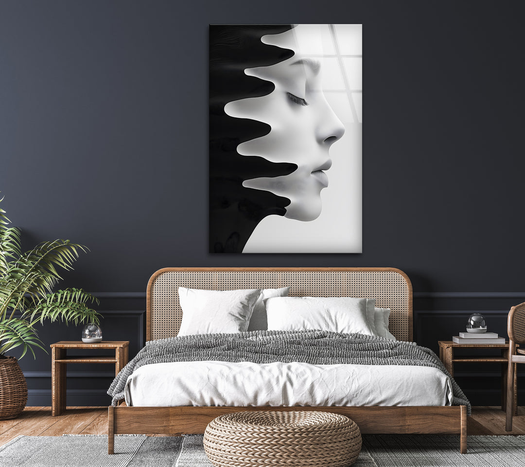 Modern glass wall art featuring a silhouette of a face in fluid motion.
