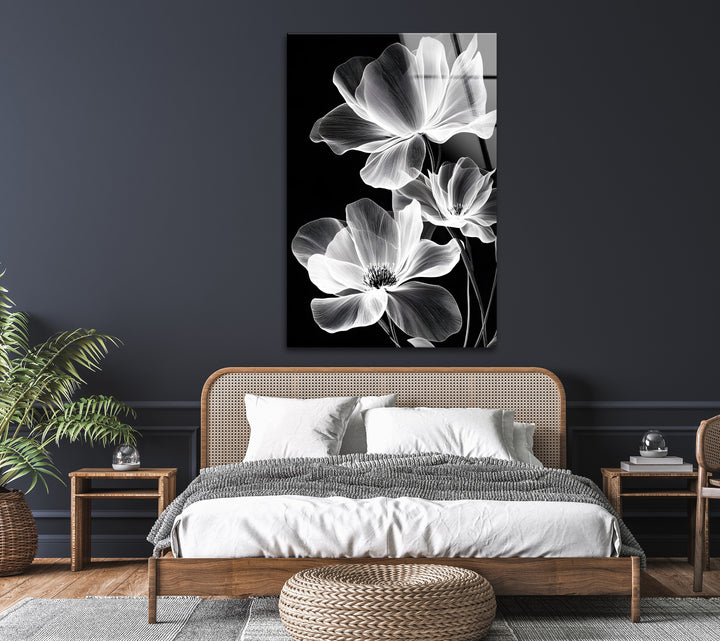 A mesmerizing botanical-inspired glass wall art piece with a luminous monochrome floral design.