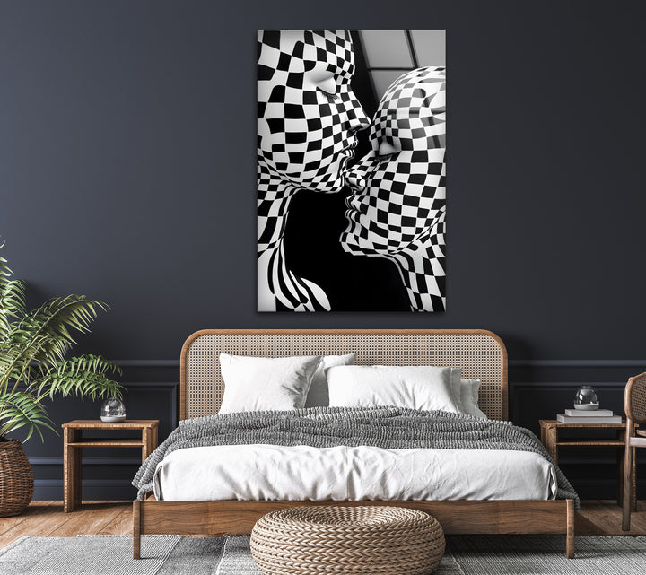 Captivating black-and-white kiss wall art with bold checkered detailing, printed on glass.
