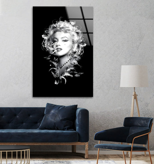 Marilyn Monroe's iconic black and white portrait on glass printing is the loudest element in this dramatic artwork.