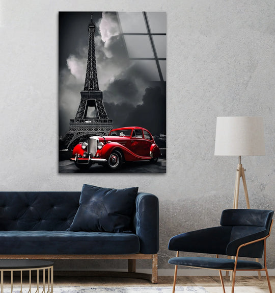 Sharp color contrast highlights a red vintage car against the black and white Eiffel Tower backdrop in this dramatic tempered glass wall art.