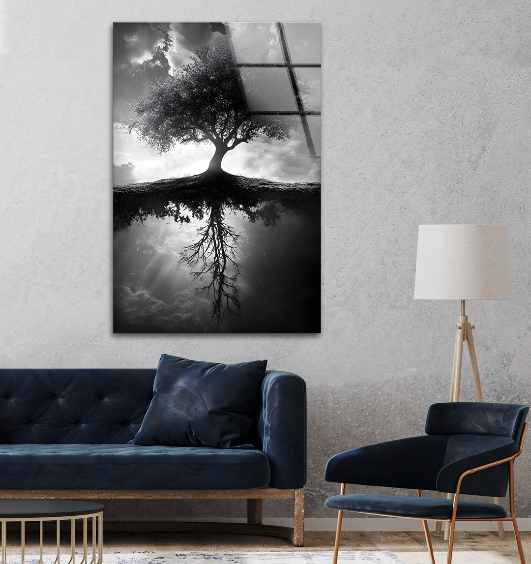 Nature-inspired black and white glass wall art with a striking tree and its detailed reflection.
