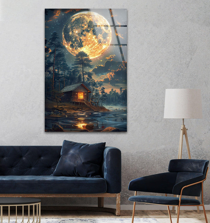 8K glass wall print of a glowing moon and a charming wooden cabin.
