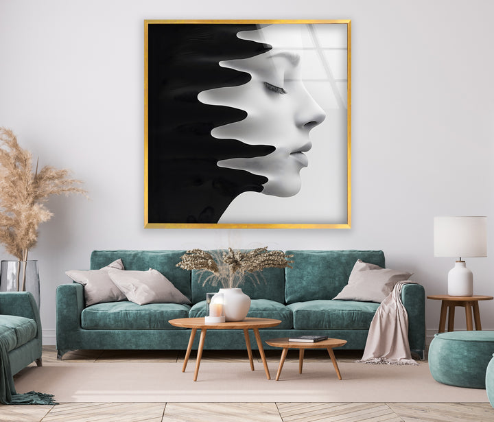 Monochrome glass art featuring a profile emerging from flowing black shapes.
