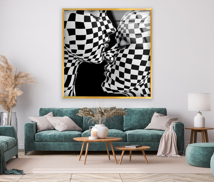 High-contrast black-and-white kiss artwork on glass, featuring an intriguing checkered pattern.
