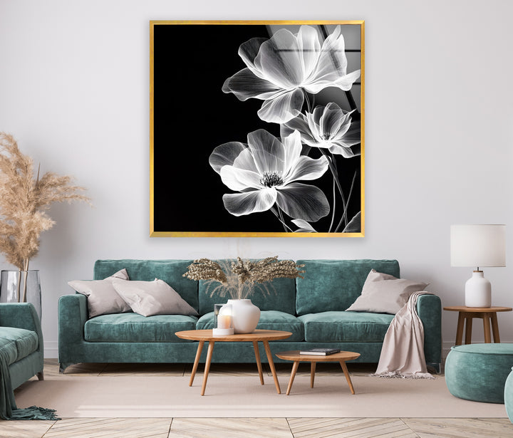 A delicate yet striking black and white glass wall art showcasing abstract floral elements.