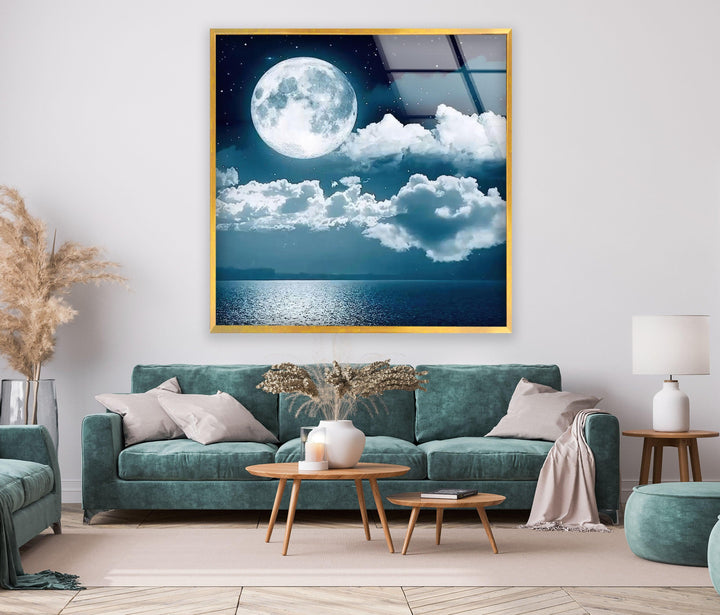 Large landscape wall art showcasing a tranquil ocean under a glowing moon.

