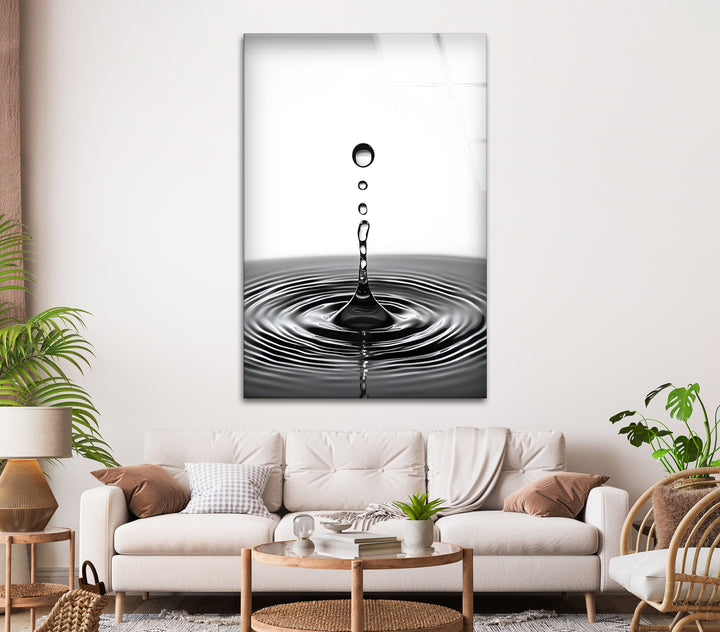 Elegant black-and-white glass wall art featuring a mesmerizing water drop design.
