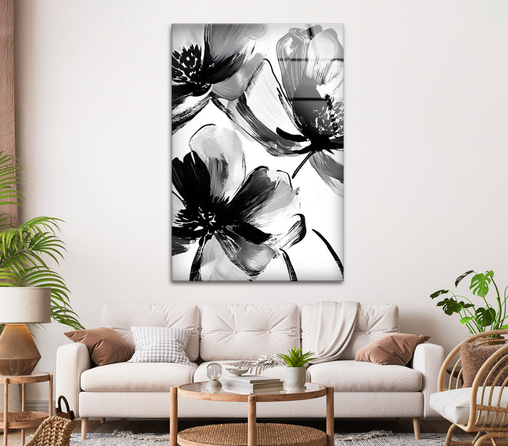 Elegant monochrome flower artwork with dynamic brushstrokes, captured on glass wall art.
