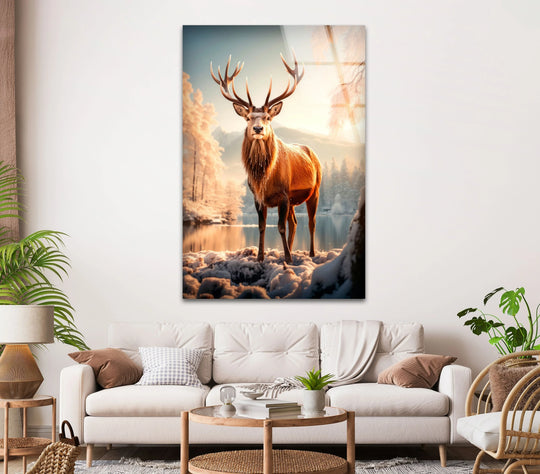 A majestic deer stands in a snowy landscape, with ample negative space emphasizing the serene winter scene in this glass printing.