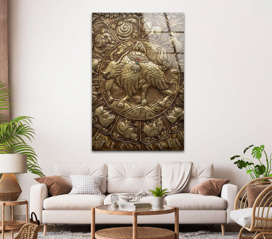 Golden decorative metal art featuring a detailed bull design with warm, rich tones, set against a neutral background.