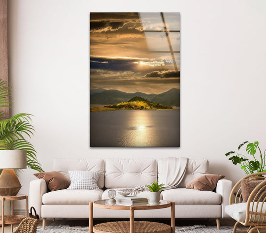 Glowing organic forms create a dramatic effect in this golden sunset glass art painting, depicting a tranquil lake surrounded by rolling mountain views.