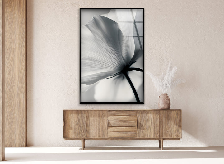 Modern Floral Art: Black and white bloom captured in elegant glass wall art, ideal for contemporary decor.
